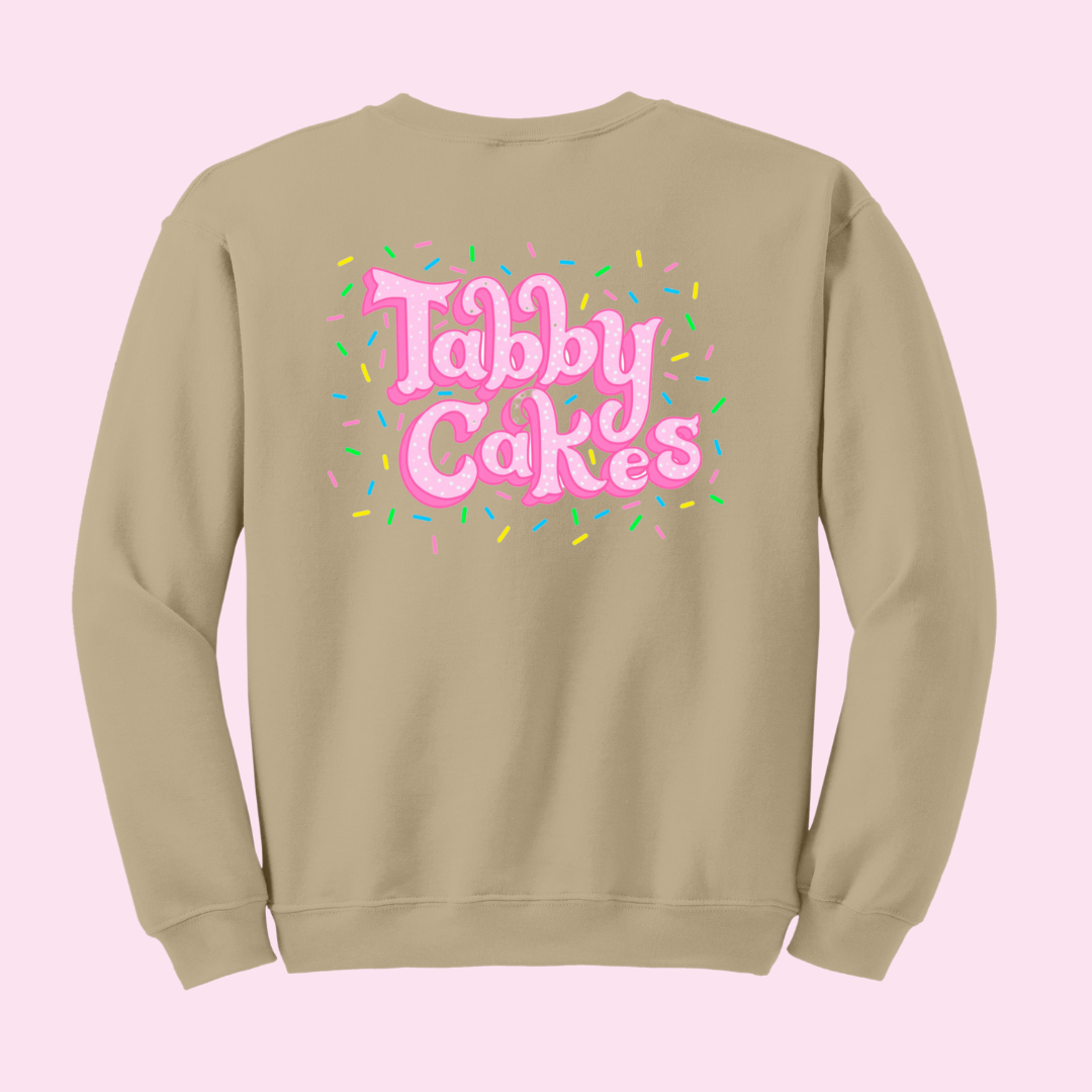 This Tabby Cakes Crew is sure to keep you warm for the winter! The dull brown color compliments the Original Tabby Cakes Cookie graphics and Tabby Cakes logo. Offered in a full size range of small to 2 XL.