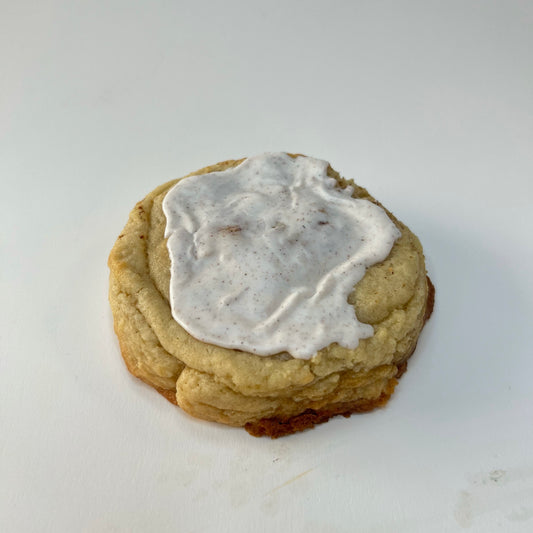 A cinnamon sugar cookie filled with Cinnamon Toast Crunch filling, topped with a sweet glaze.