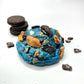 This monstrous cookie with blue cookie dough is stuffed with Chips-Ahoy and Oreos for that cookie lover!