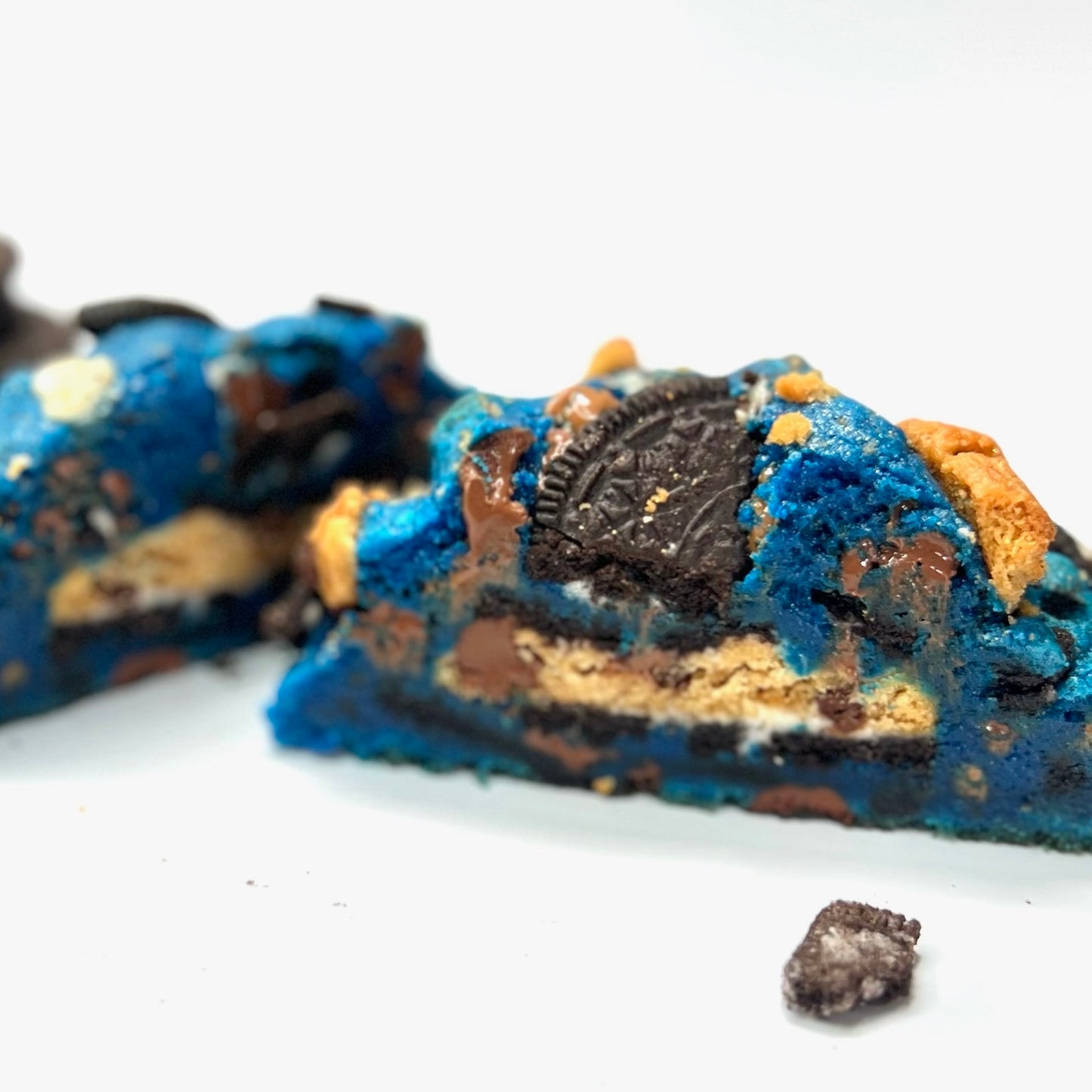 This monstrous cookie with blue cookie dough is stuffed with Chips-Ahoy and Oreos for that cookie lover!